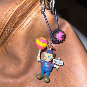 Purse/backpack fob Friday At Freddie’s.